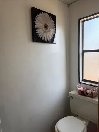 a bathroom with a toilet and a vanity