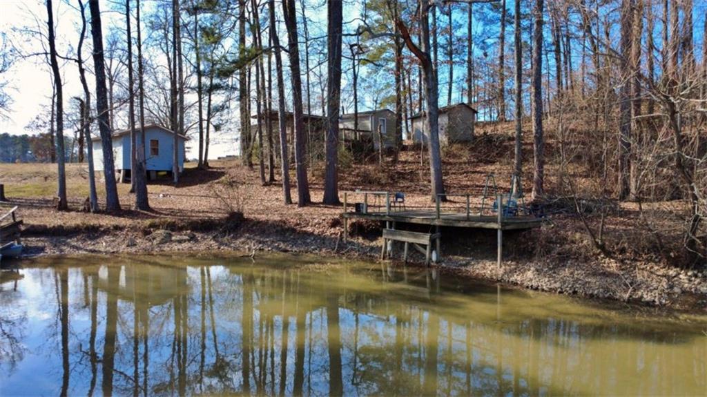 7112 Blacks Bluff Road Southwest Cave Spring, GA 30124 - Photo 13 of 22 a view of swimming pool with a yard and large trees