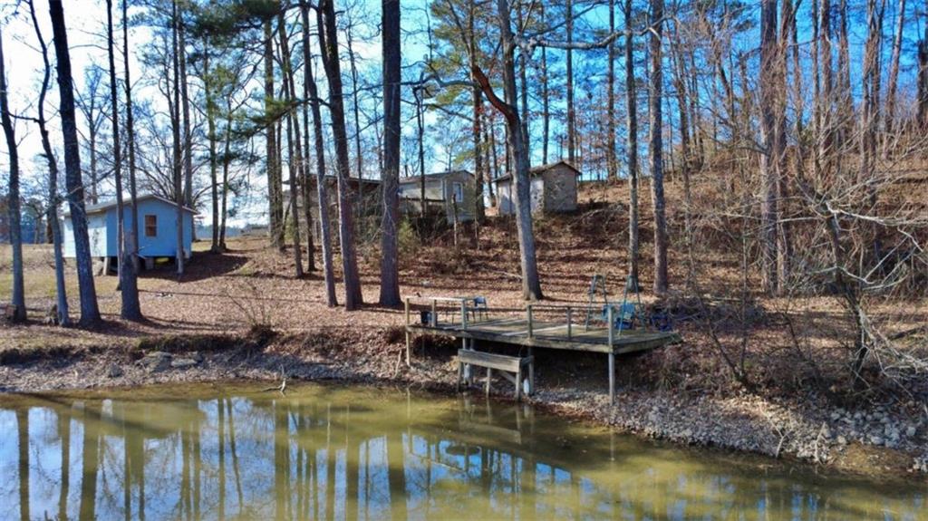 7112 Blacks Bluff Road Southwest Cave Spring, GA 30124 - Photo 17 of 22 a view of house with large trees