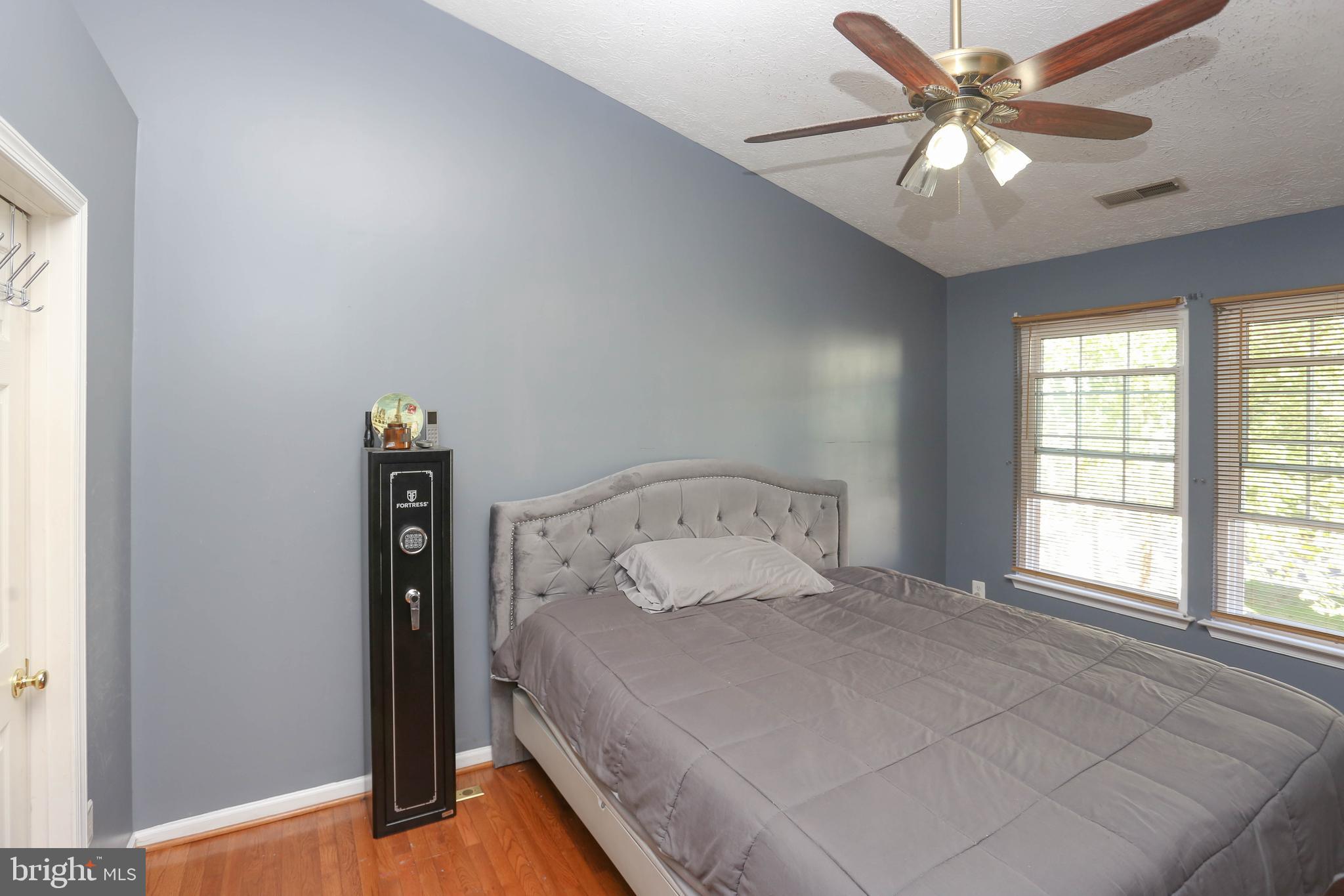 1734 Sea Pine Circle, Unit 136 Severn, MD 21144 - Photo 19 of 32 a bedroom with a bed and a window