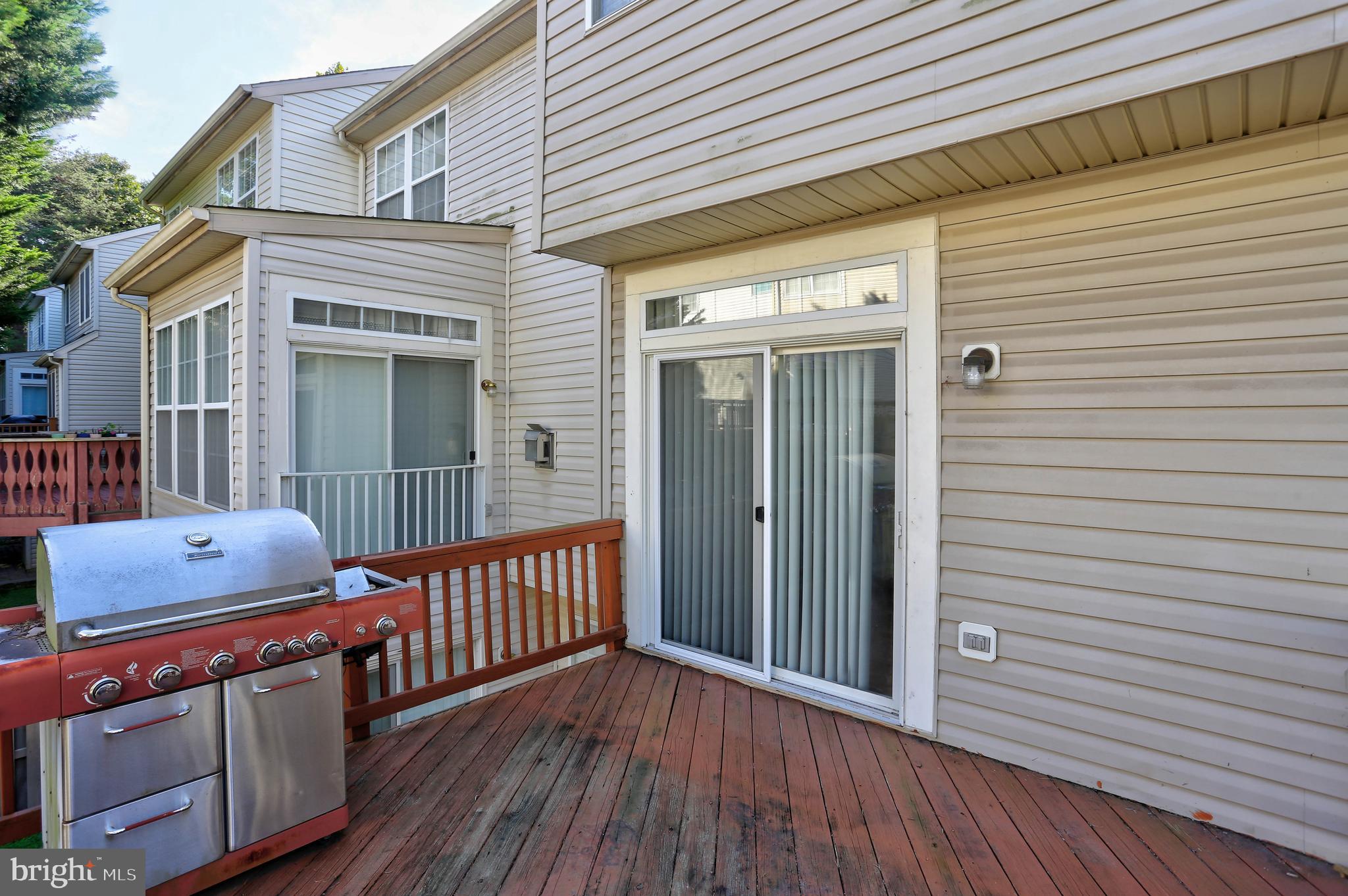 1734 Sea Pine Circle, Unit 136 Severn, MD 21144 - Photo 29 of 32 a view of a deck with wooden floor
