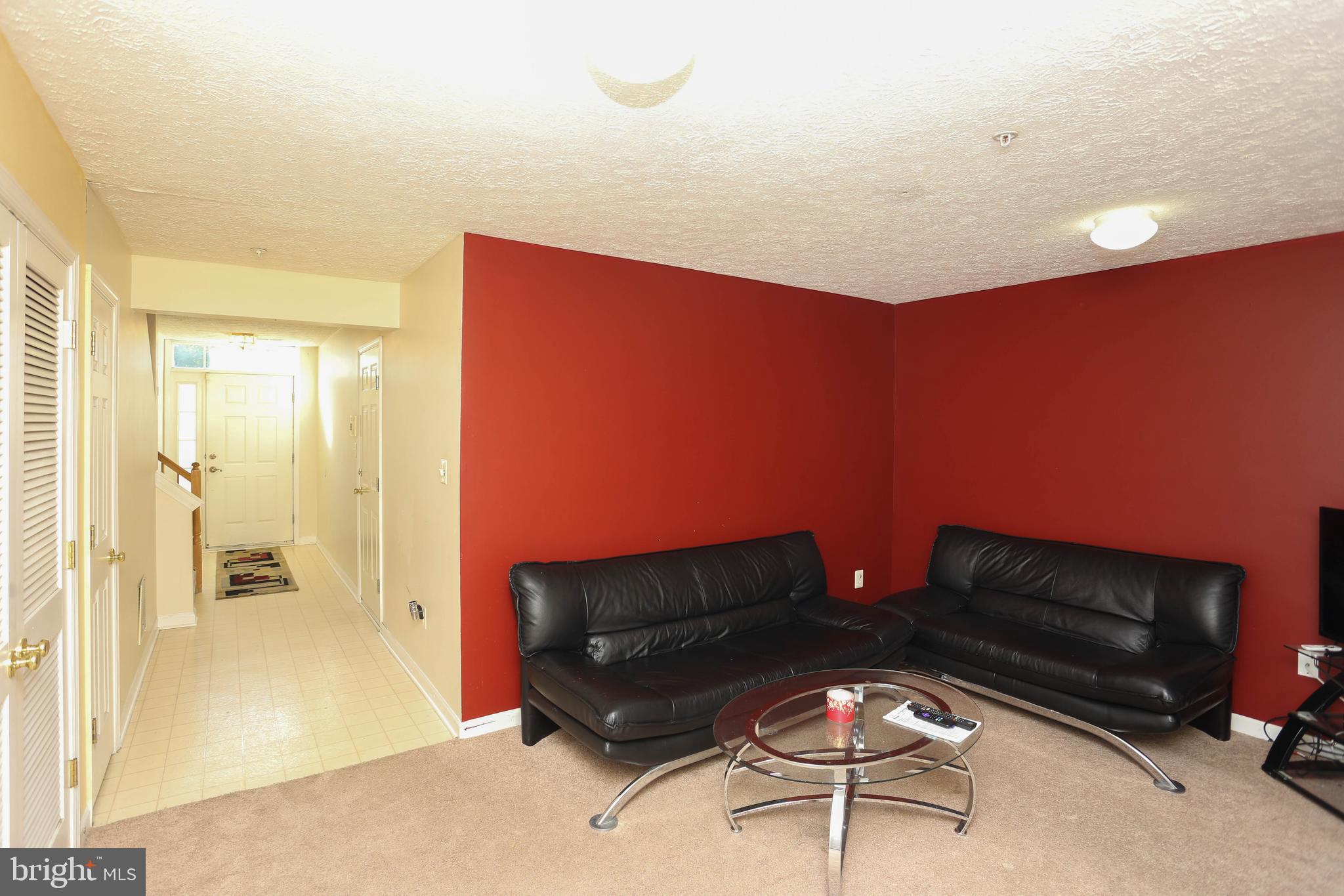 1734 Sea Pine Circle, Unit 136 Severn, MD 21144 - Photo 8 of 32 a living room with furniture