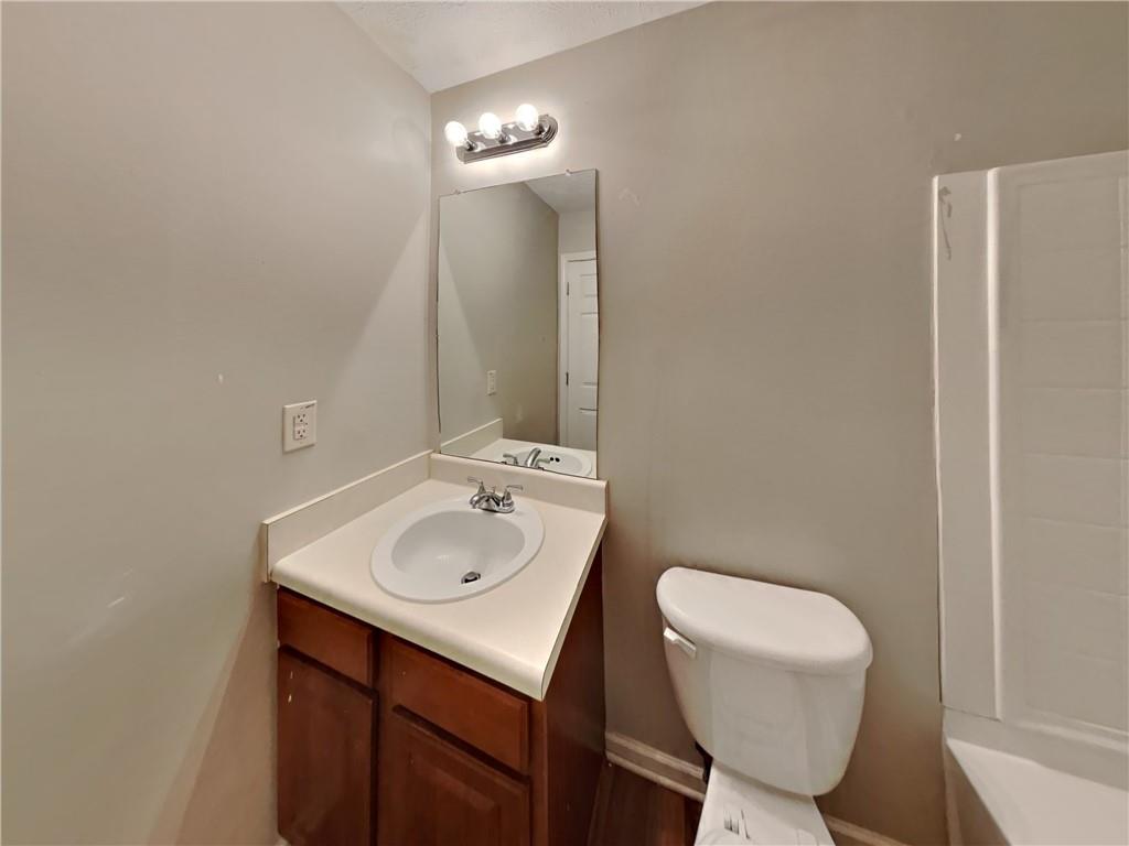 3527 Waldrop Trail Decatur, GA 30034 - Photo 13 of 20 a bathroom with a toilet sink and mirror