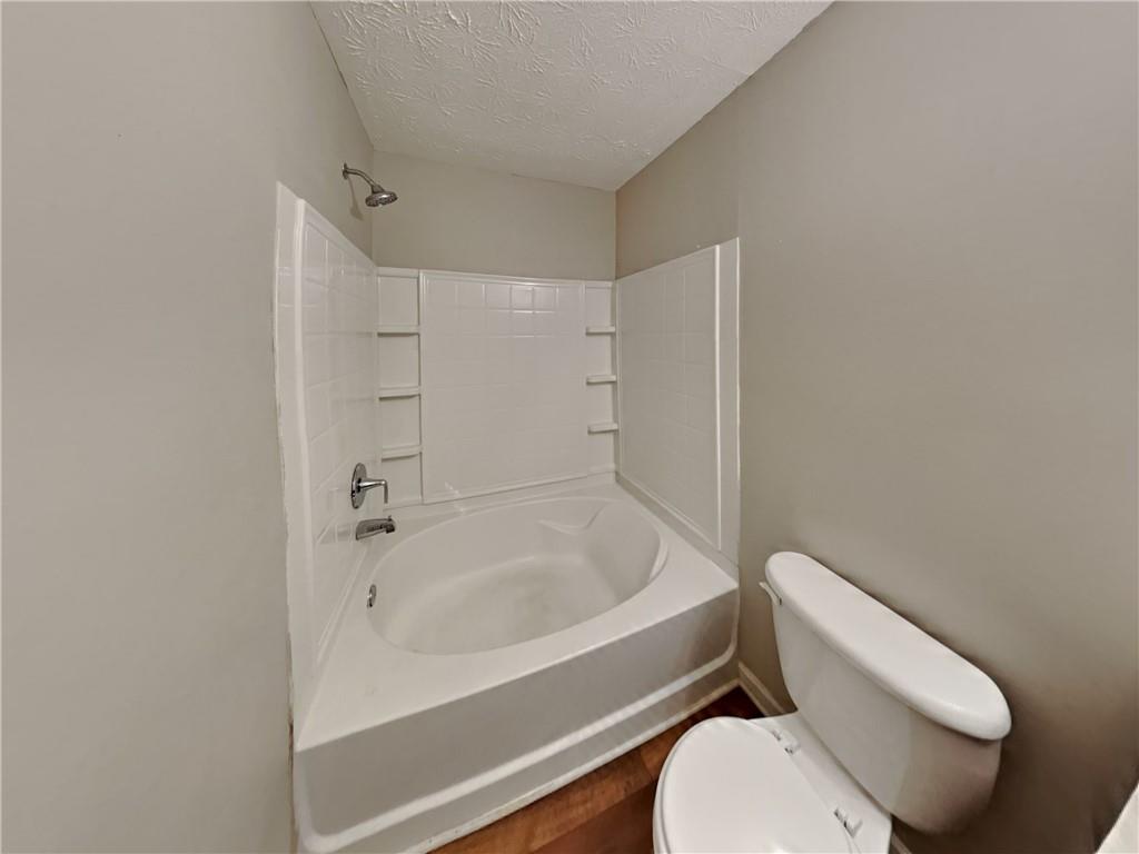 3527 Waldrop Trail Decatur, GA 30034 - Photo 16 of 20 a white toilet sitting next to a bath tub