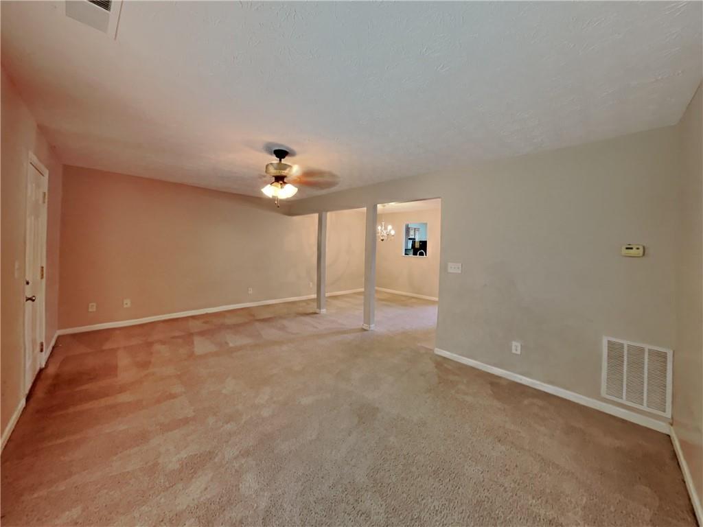 3527 Waldrop Trail Decatur, GA 30034 - Photo 3 of 20 a view of an empty room with a chandelier fan