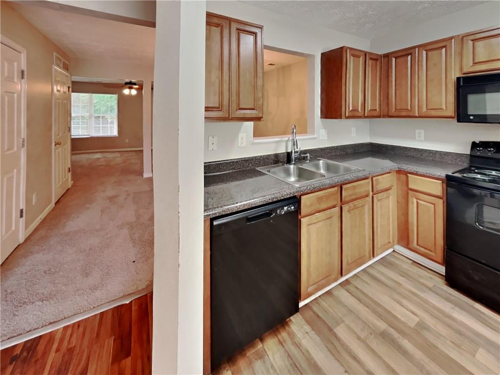 3527 Waldrop Trail Decatur, GA 30034 - Photo 7 of 20 a kitchen with stainless steel appliances granite countertop a sink stove and refrigerator