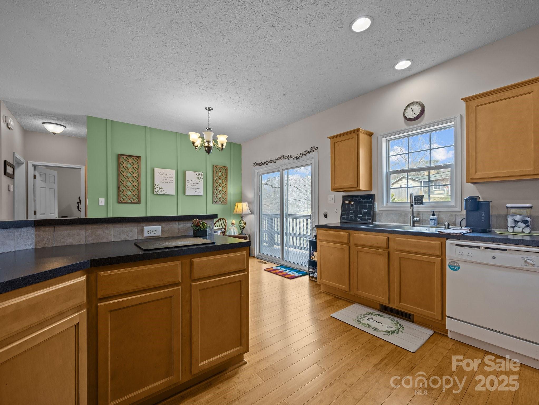 233 Thompson Cv Road Clyde, NC 28721 - Photo 13 of 25 a kitchen with stainless steel appliances granite countertop a sink stove and cabinets