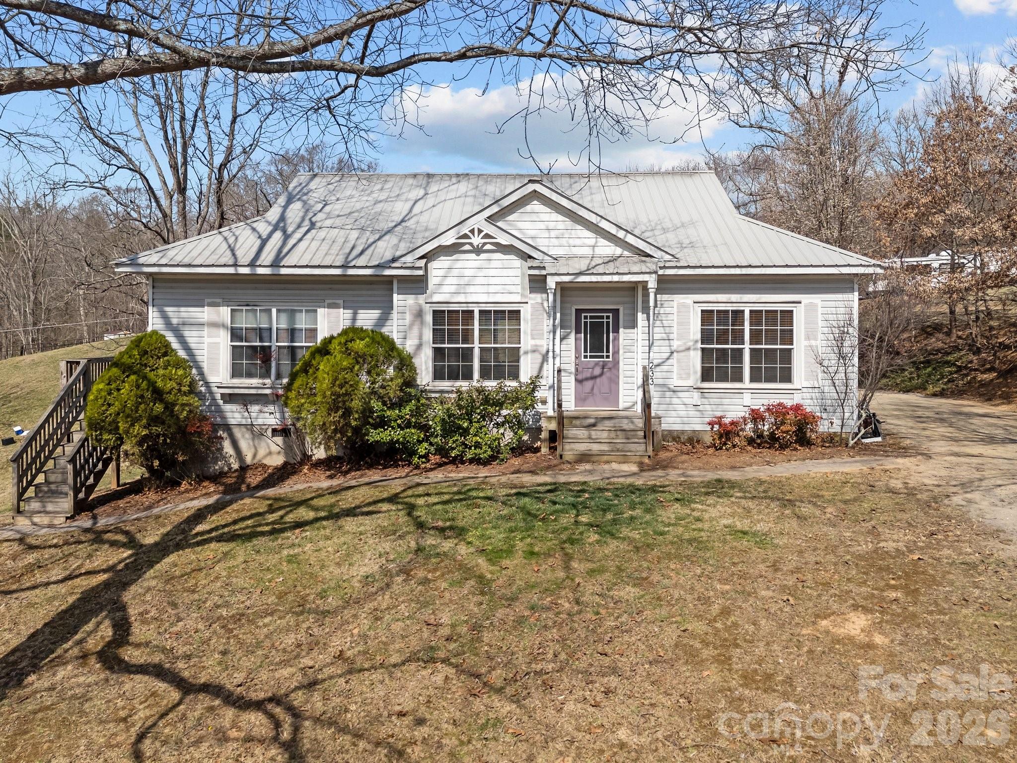 233 Thompson Cv Road Clyde, NC 28721 - Photo 2 of 24 a front view of a house with garden