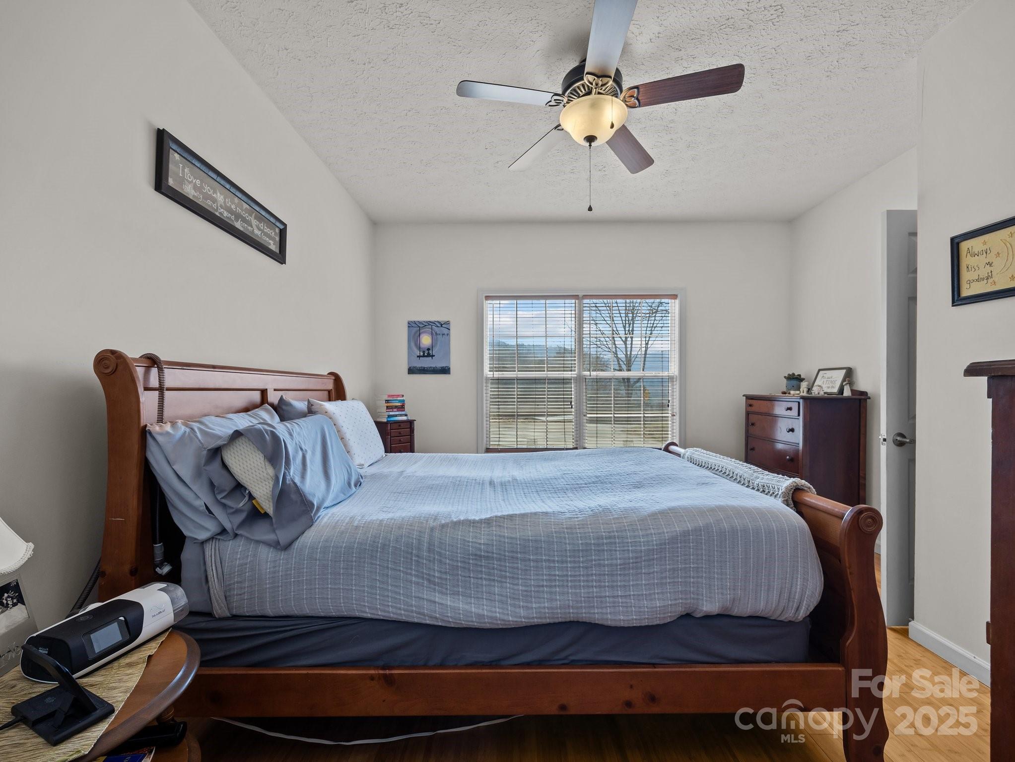 233 Thompson Cv Road Clyde, NC 28721 - Photo 22 of 25 a bedroom with a bed and window