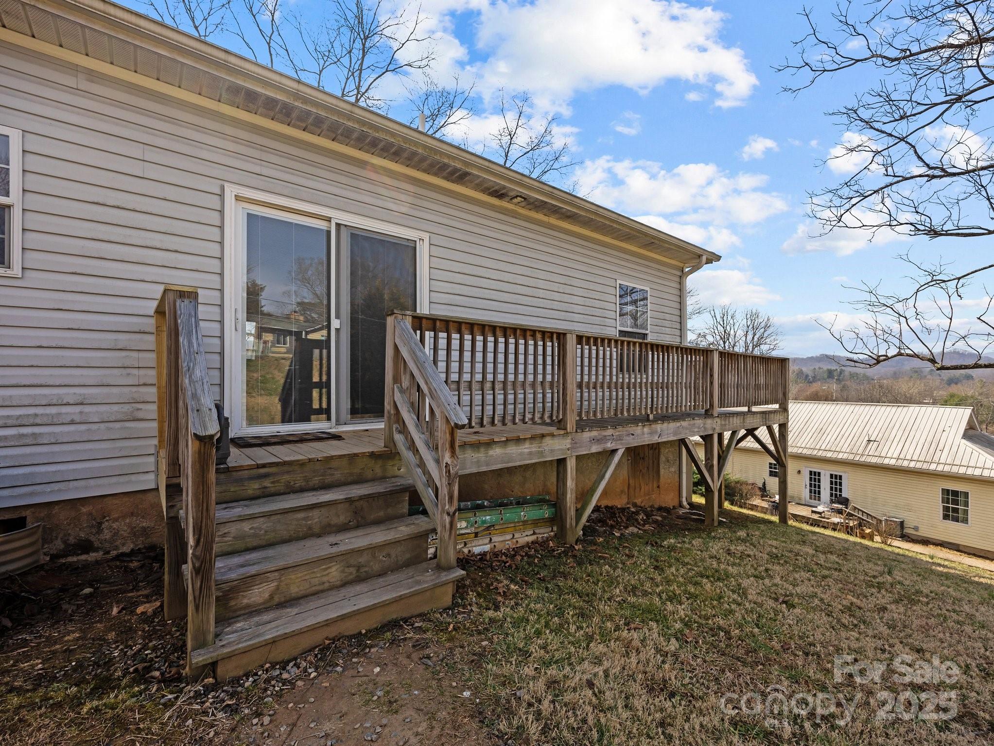 233 Thompson Cv Road Clyde, NC 28721 - Photo 24 of 25 a view of a chair and table in backyard