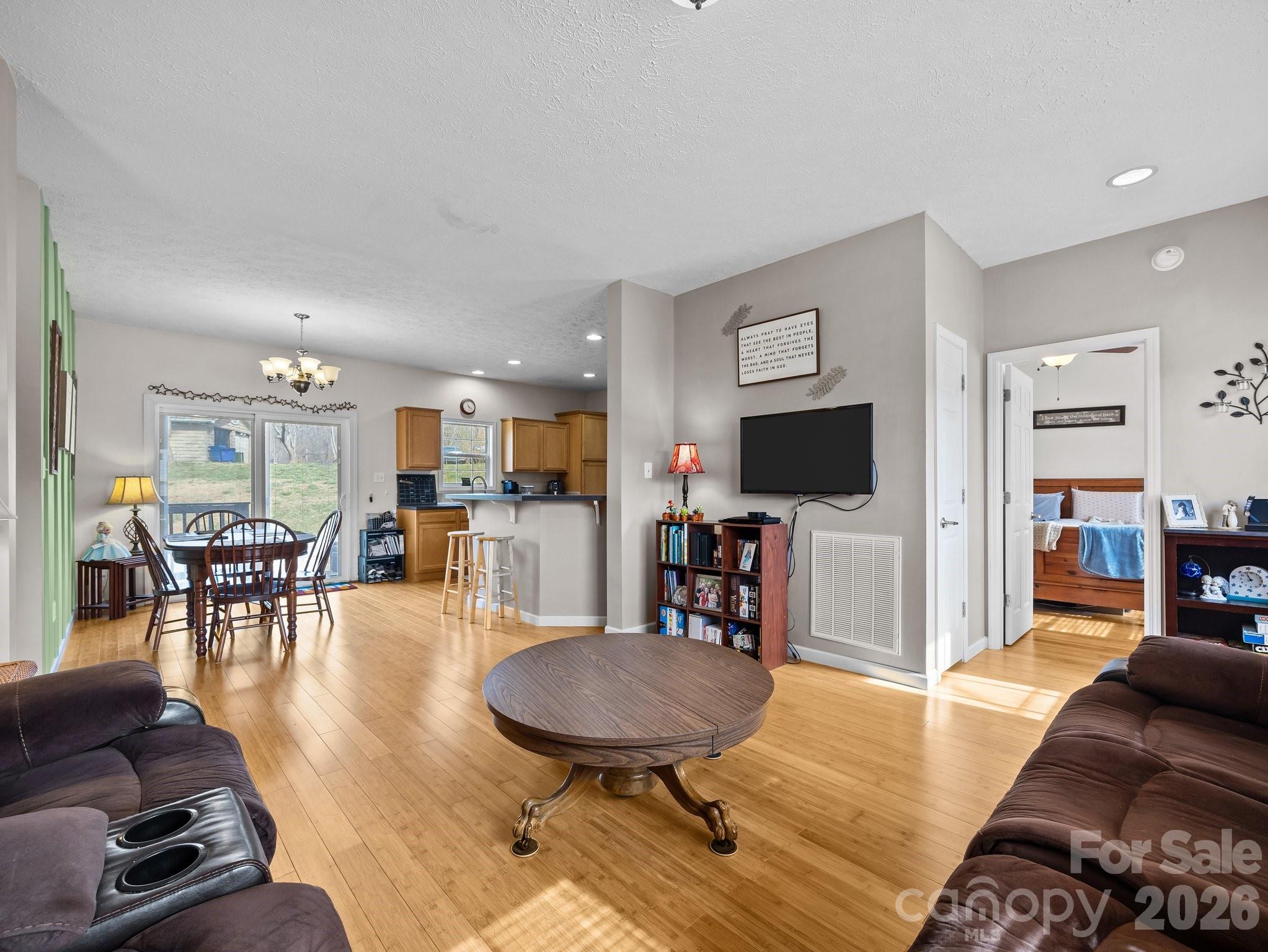 233 Thompson Cv Road Clyde, NC 28721 - Photo 7 of 24 a living room with furniture and a flat screen tv