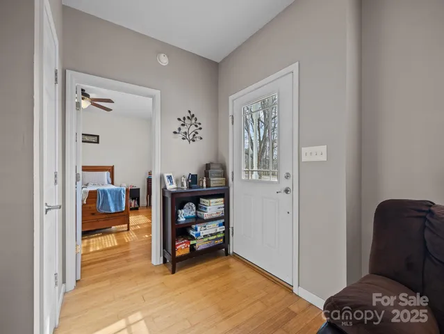 a bedroom with furniture and a window