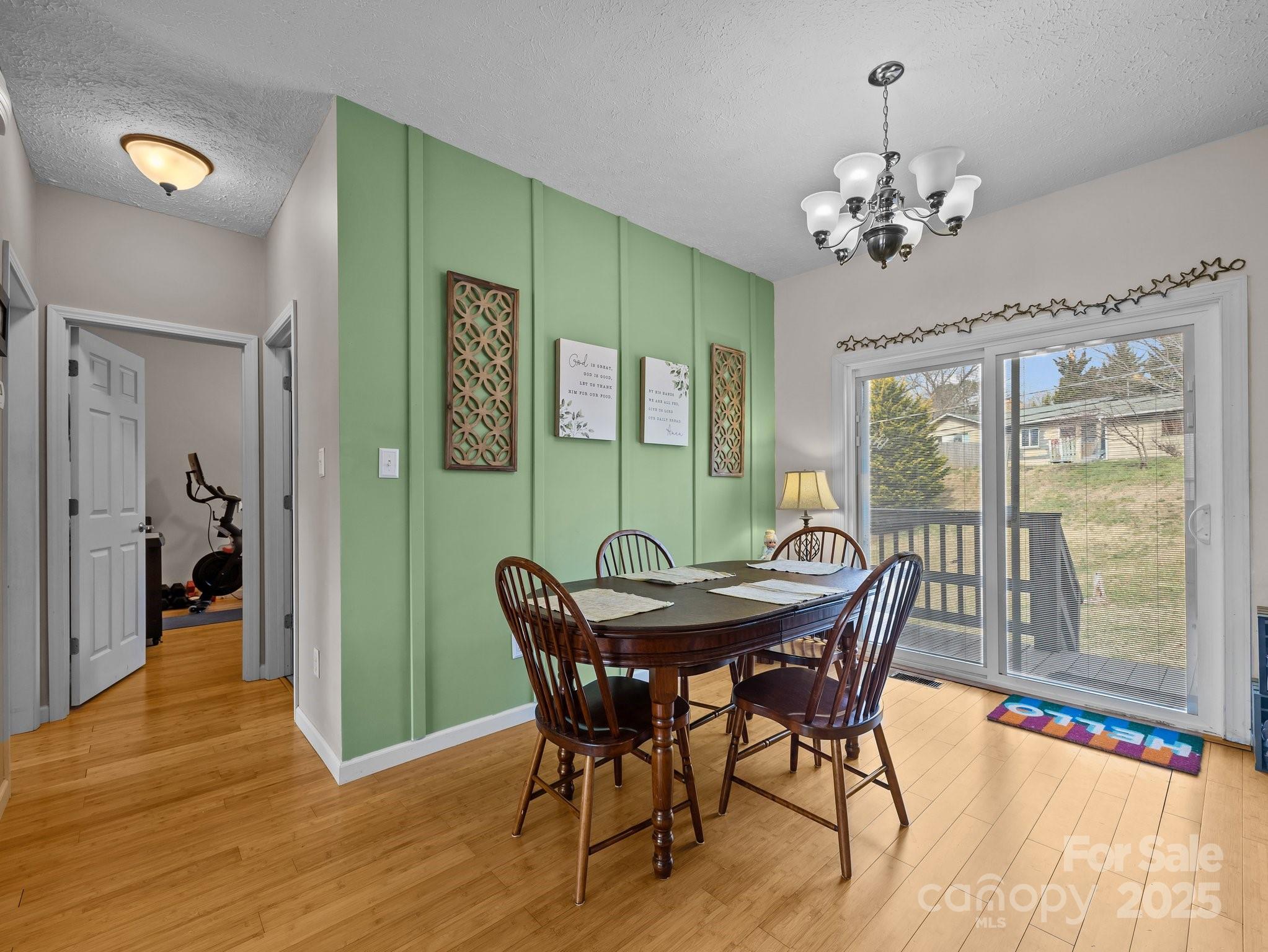 233 Thompson Cv Road Clyde, NC 28721 - Photo 10 of 25 a view of a dining room with furniture window and wooden floor