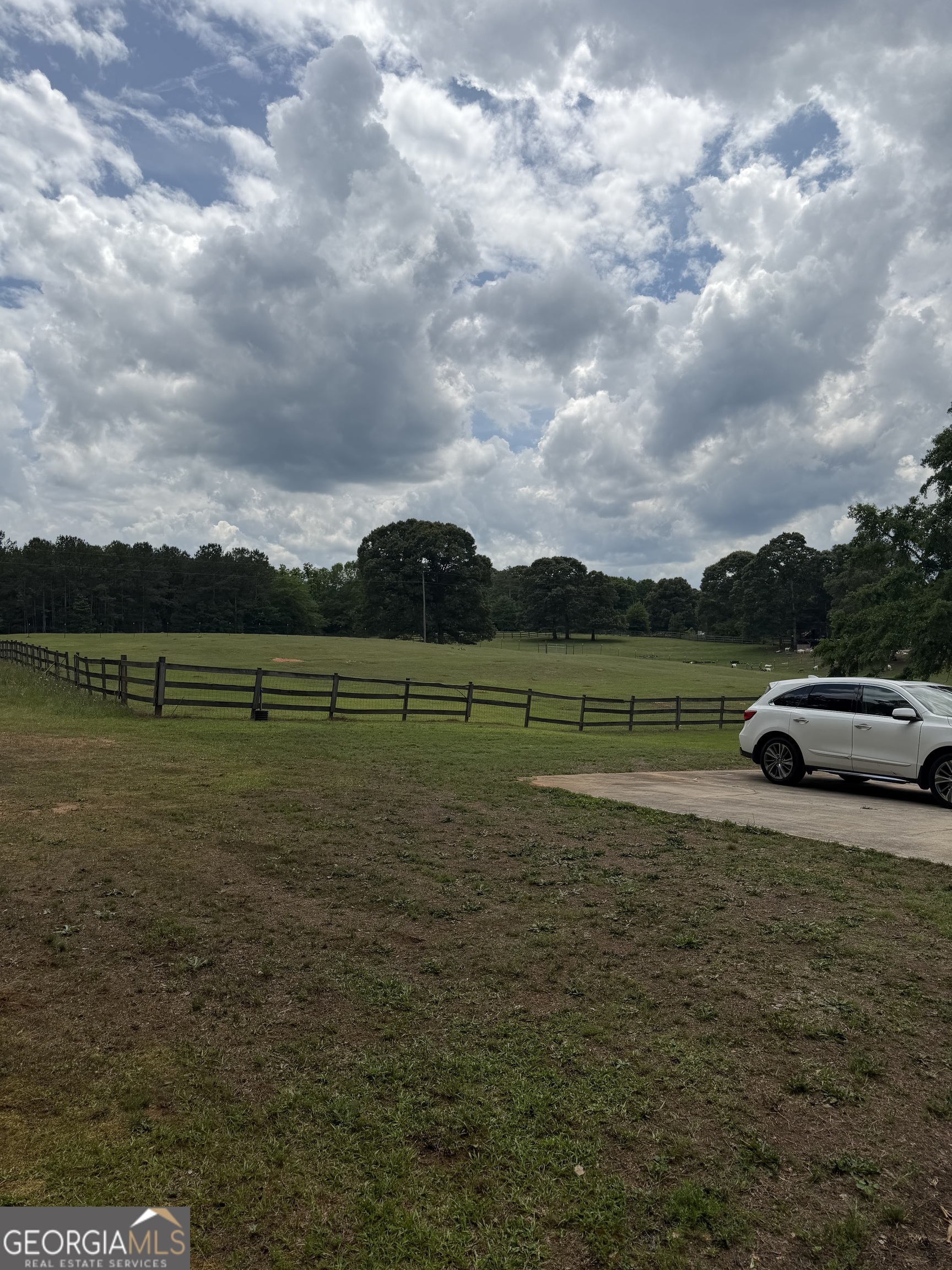 302 Norris Road Barnesville, GA 30204 - Photo 10 of 65 a view of a golf course with a lake