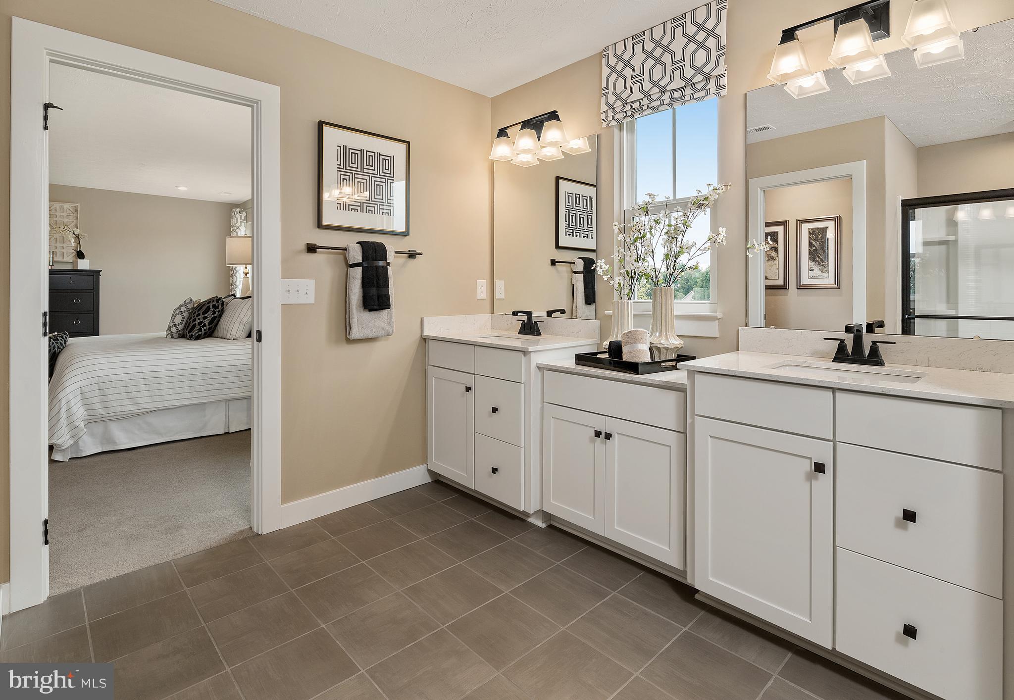 47 Wallace Way Ranson, WV 25438 - Photo 15 of 20 a spacious en suite bathroom with double sink and a mirror