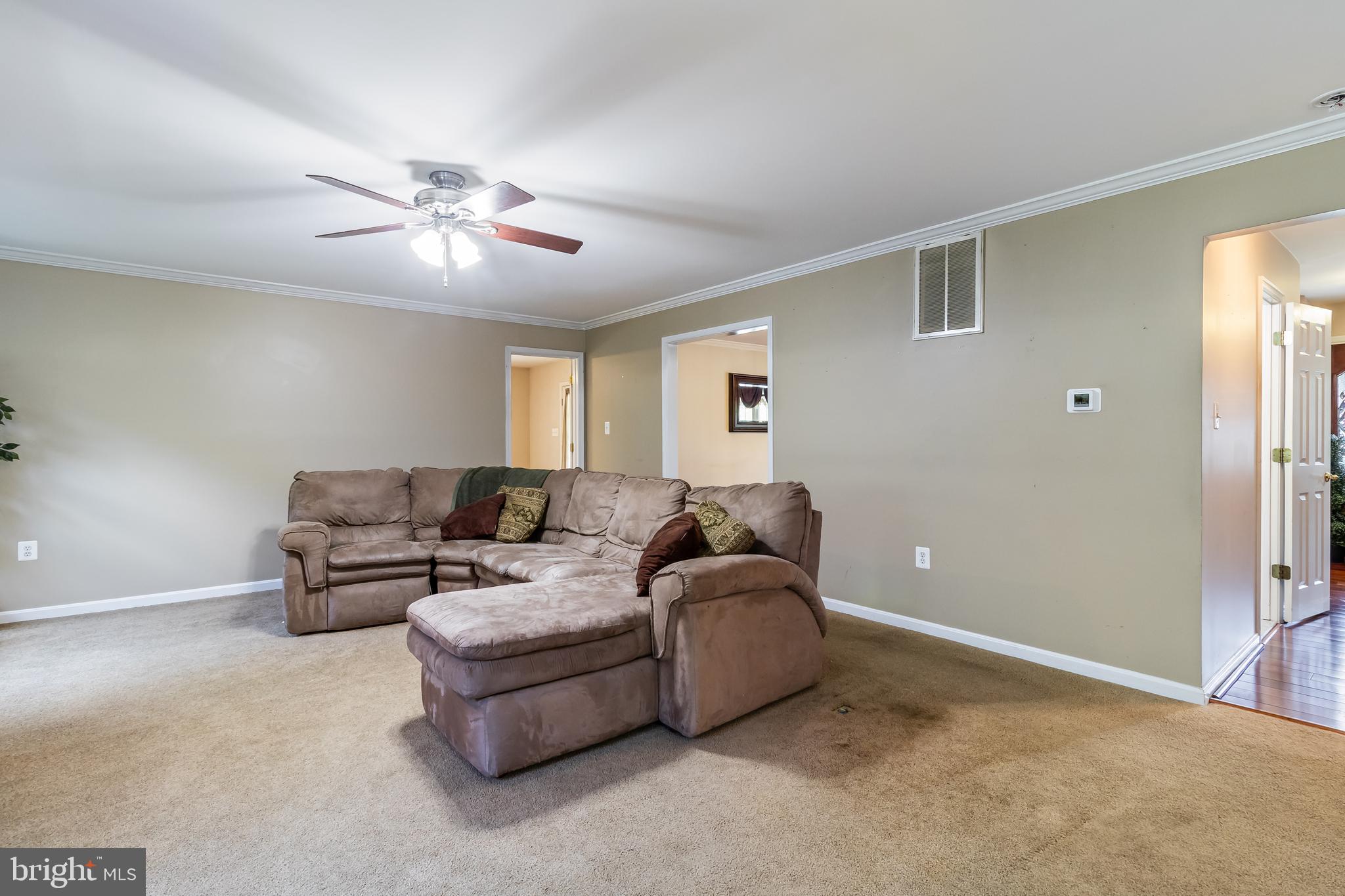 203 Morgans Ridge Court La Plata, MD 20646 - Photo 24 of 59 a living room with furniture and a ceiling fan