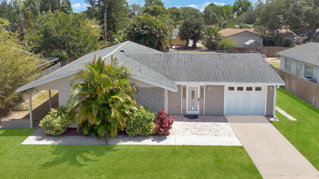 2879 Lancaster Road Melbourne, FL 32935 - Photo 21 of 28 a aerial view of a house with a yard and potted plants
