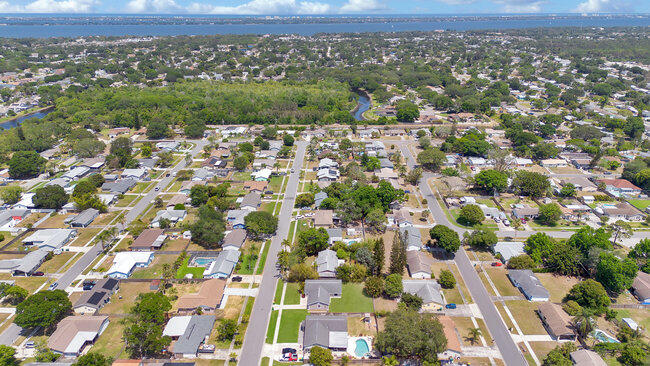 2879 Lancaster Road Melbourne, FL 32935 - Photo 25 of 28 an aerial view of residential houses with outdoor space