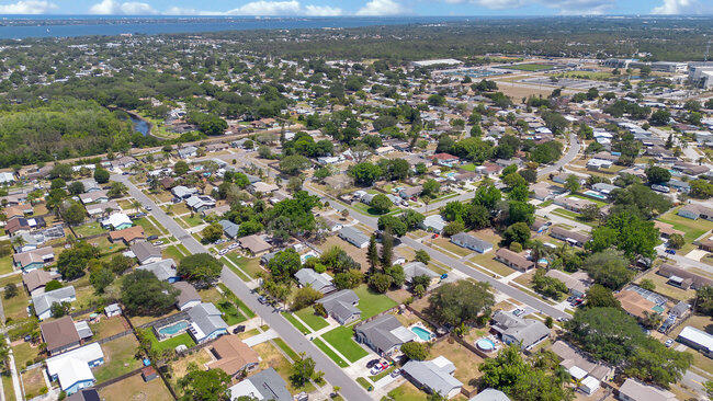 2879 Lancaster Road Melbourne, FL 32935 - Photo 26 of 28 an aerial view of residential houses with city view