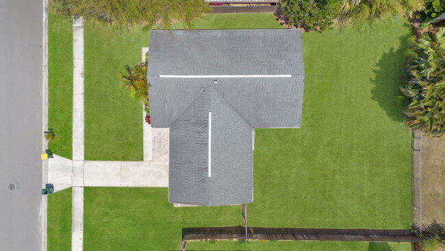 2879 Lancaster Road Melbourne, FL 32935 - Photo 27 of 28 an aerial view of a house with a yard