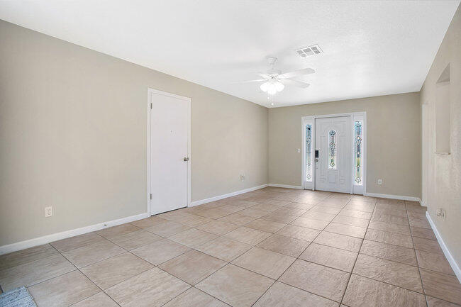 2879 Lancaster Road Melbourne, FL 32935 - Photo 3 of 28 a view of an empty room with a window