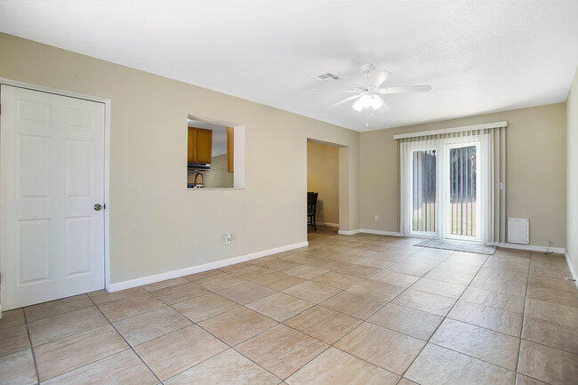 2879 Lancaster Road Melbourne, FL 32935 - Photo 4 of 28 a view of an empty room with a window