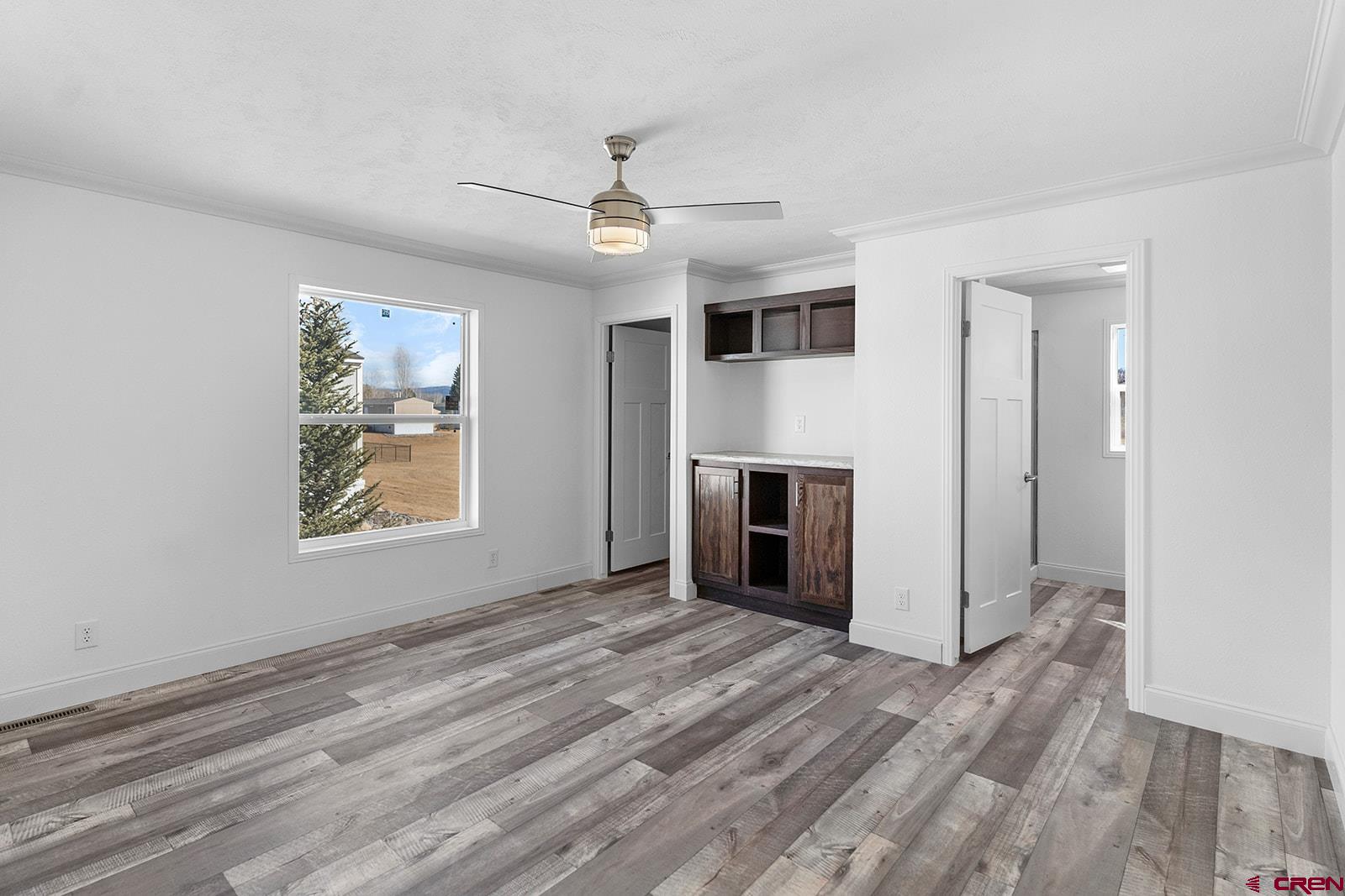 62650 Lasalle Road, Unit 330 Montrose, CO 81403 - Photo 14 of 23 an empty room with windows and fireplace