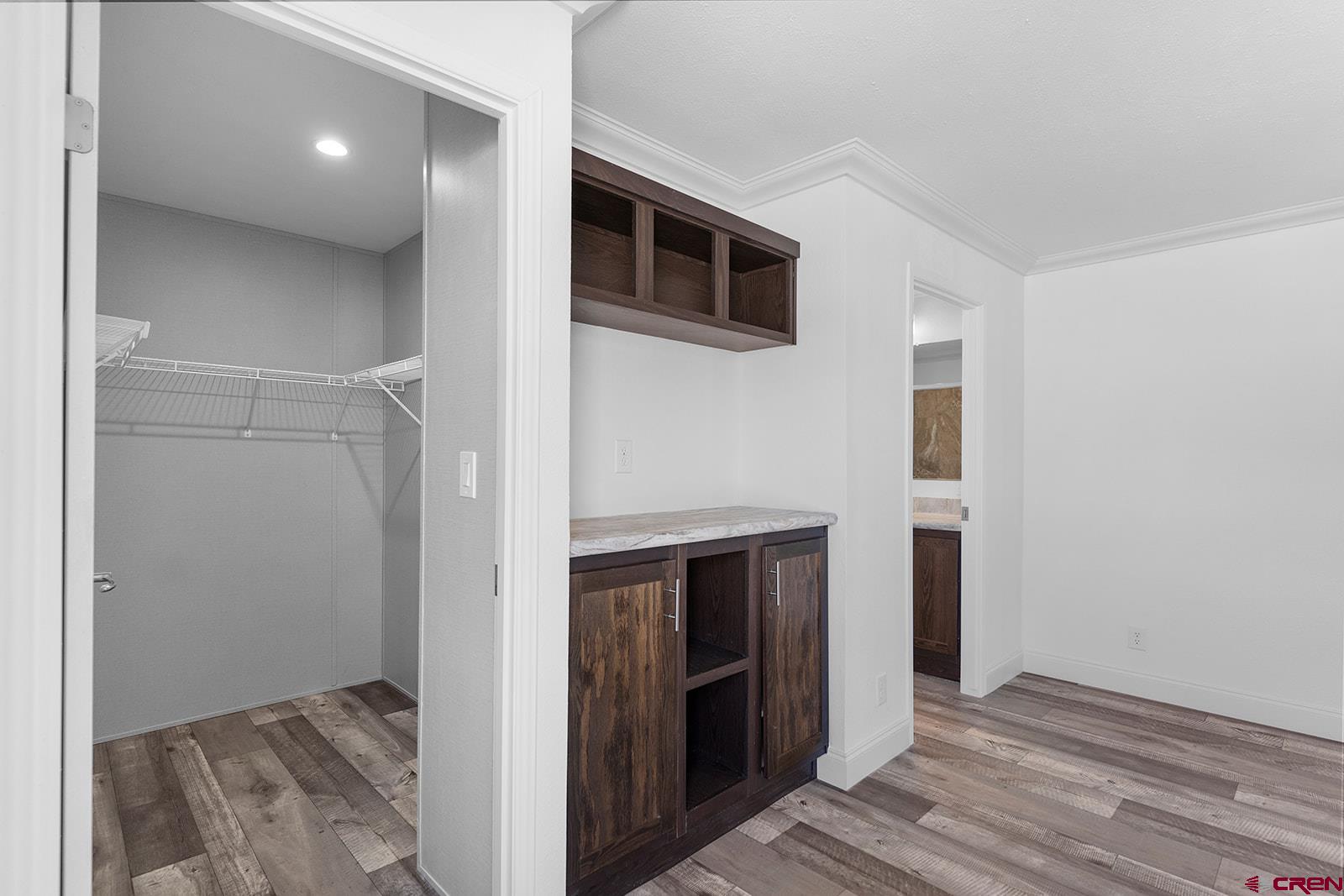 62650 Lasalle Road, Unit 330 Montrose, CO 81403 - Photo 15 of 23 a view of hallway with stairs and wooden floor