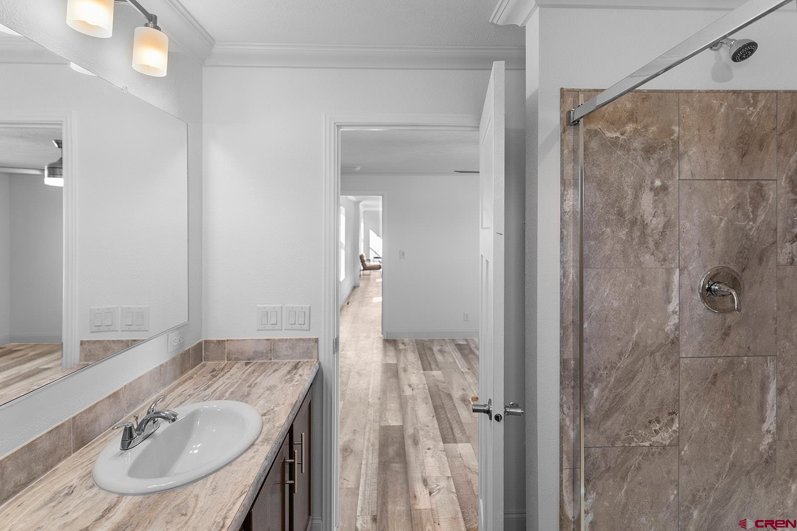 62650 Lasalle Road, Unit 330 Montrose, CO 81403 - Photo 17 of 23 a bathroom with a sink and a mirror