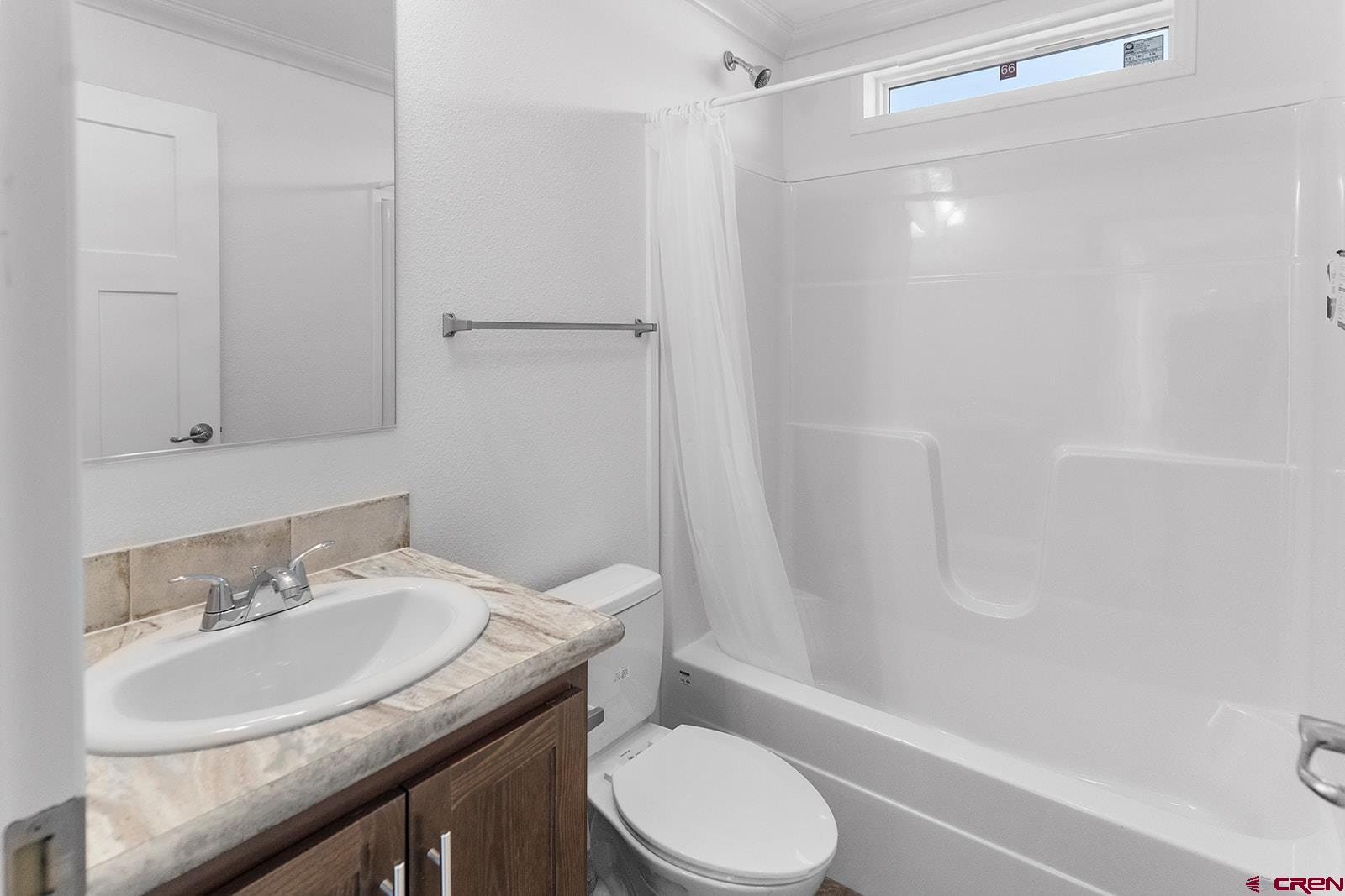 62650 Lasalle Road, Unit 330 Montrose, CO 81403 - Photo 6 of 23 a bathroom with a granite countertop sink toilet and shower