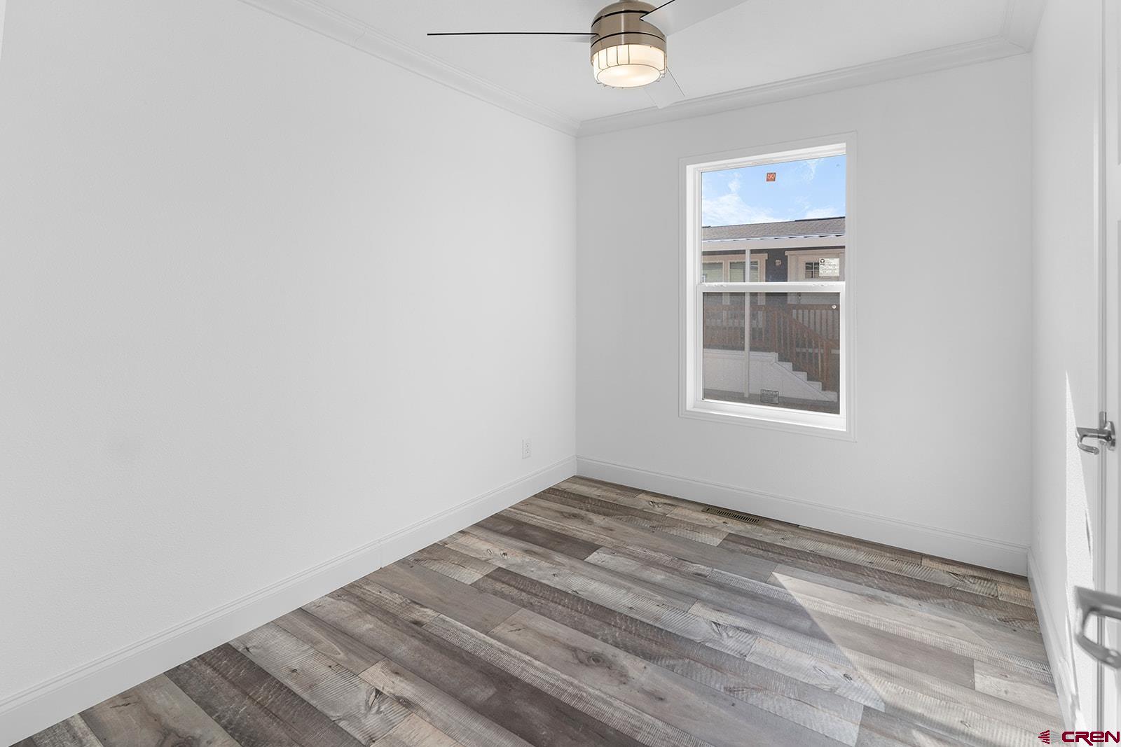 62650 Lasalle Road, Unit 330 Montrose, CO 81403 - Photo 8 of 23 an empty room with windows