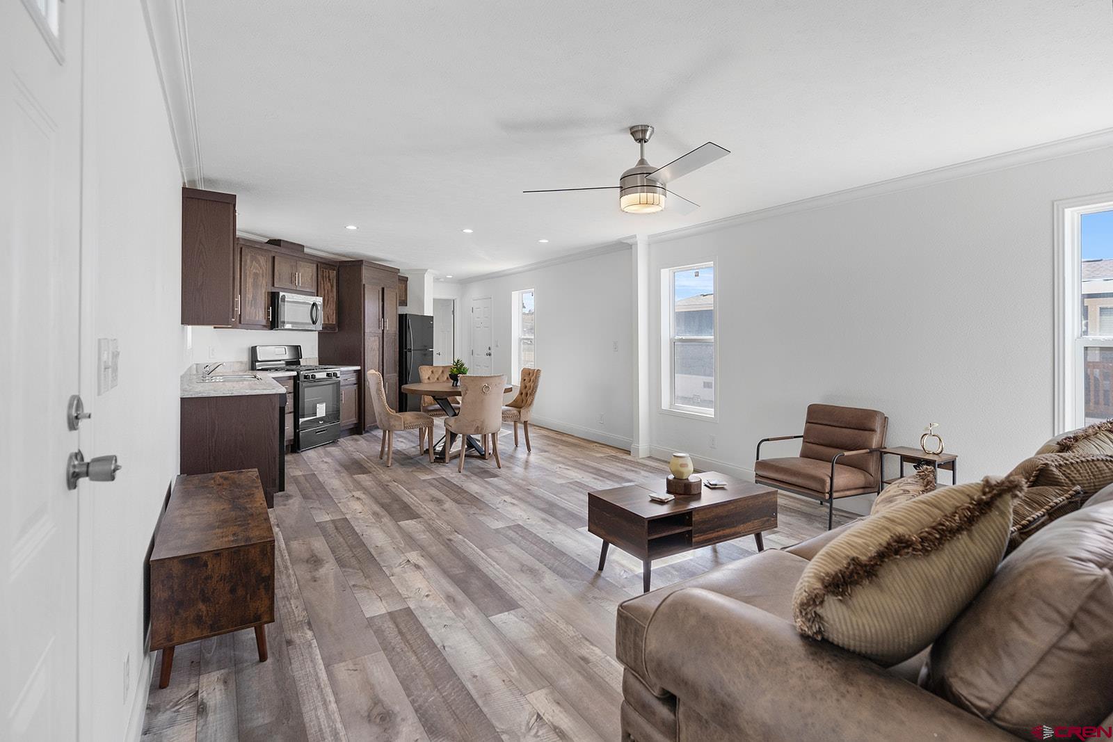 62650 Lasalle Road, Unit 330 Montrose, CO 81403 - Photo 9 of 23 a living room with furniture and a wooden floor