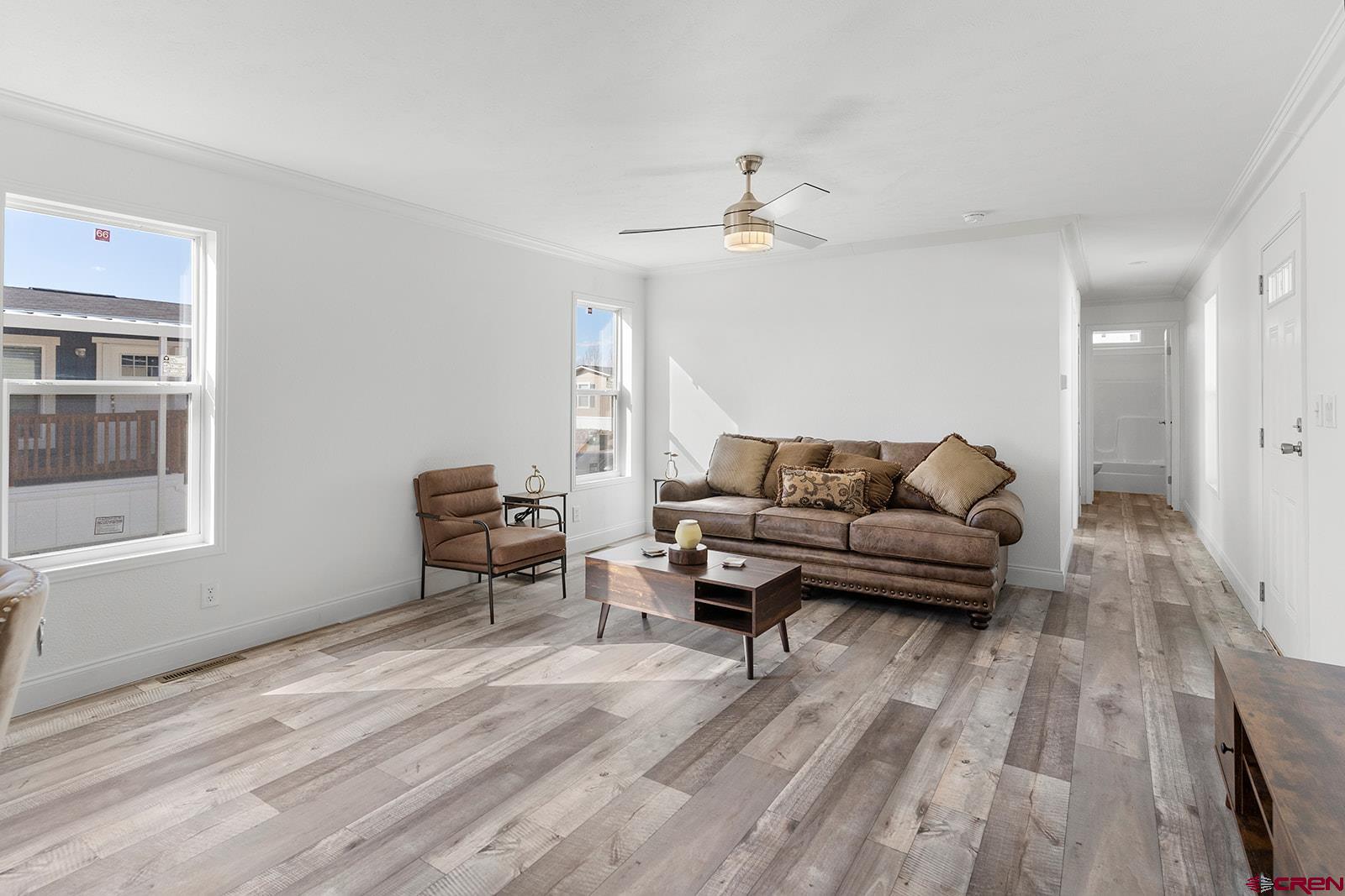 62650 Lasalle Road, Unit 330 Montrose, CO 81403 - Photo 10 of 23 a living room with furniture and wooden floor