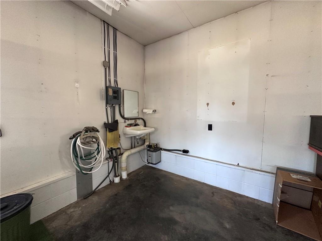978 Pollock Store Road Slippery Rock, PA 16057 - Photo 23 of 25 a view of storage and utility room with racks on the wall