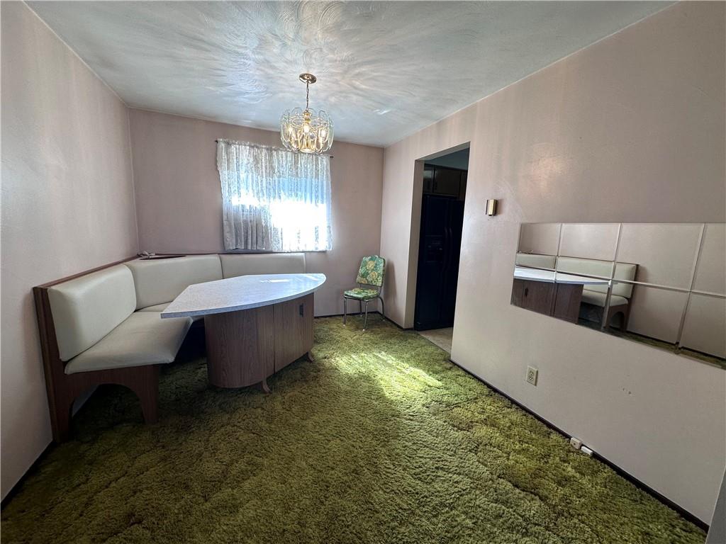 978 Pollock Store Road Slippery Rock, PA 16057 - Photo 5 of 25 a living room with furniture and a chandelier