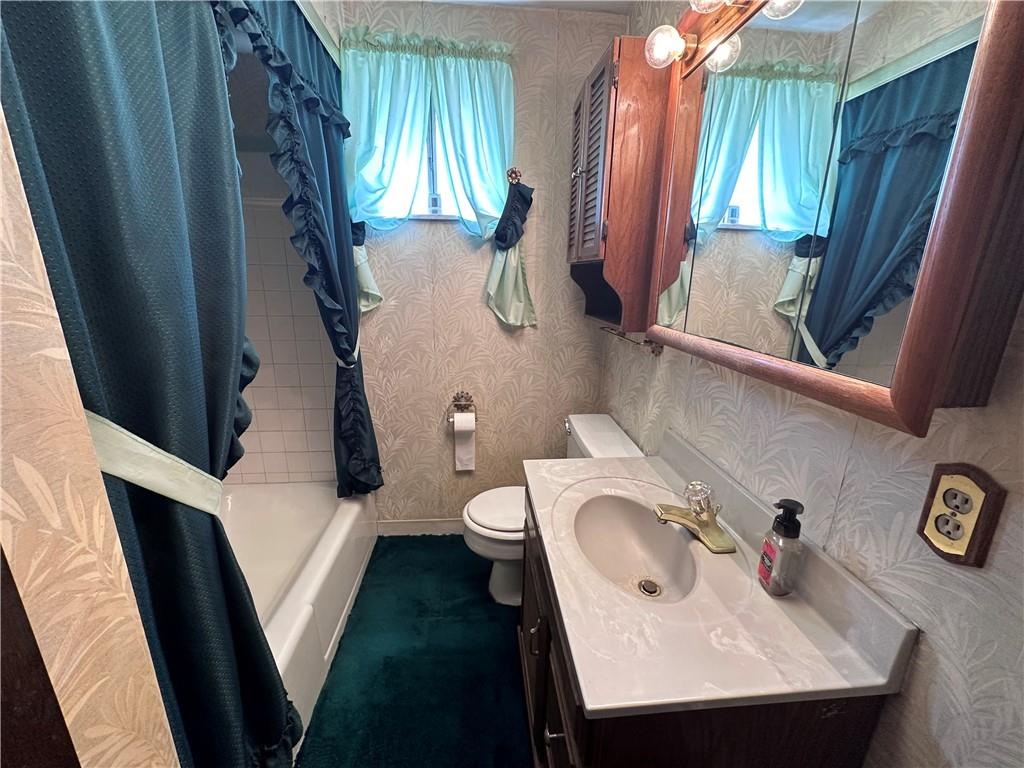 978 Pollock Store Road Slippery Rock, PA 16057 - Photo 6 of 25 a bathroom with a sink and mirror with toilet