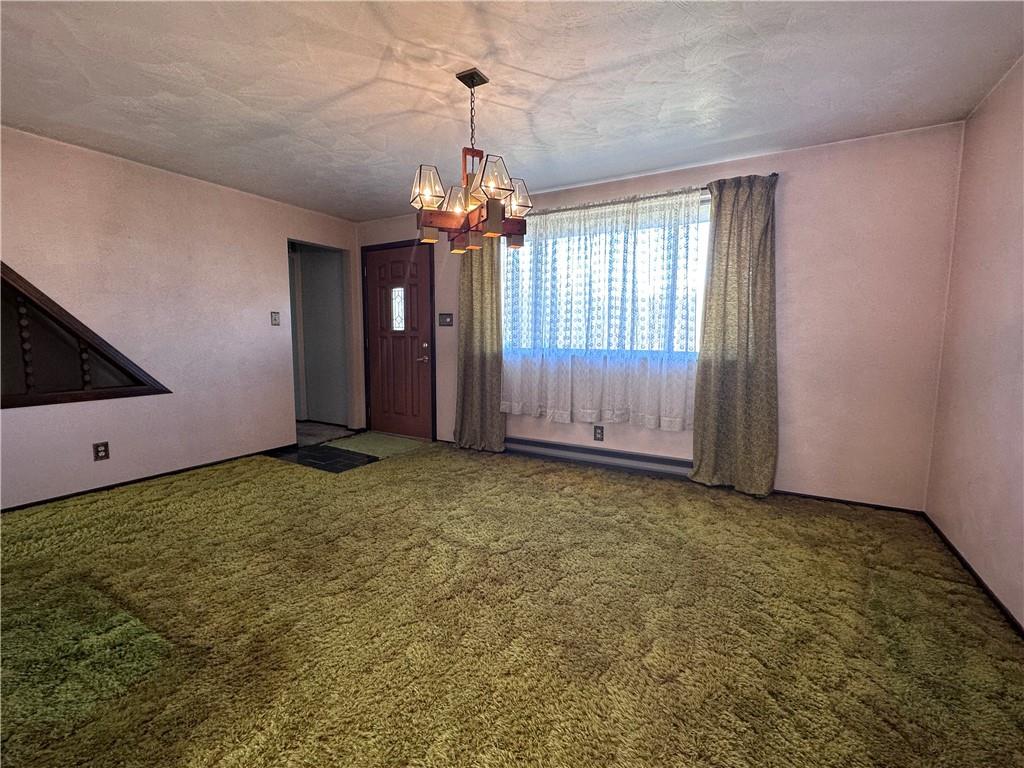 978 Pollock Store Road Slippery Rock, PA 16057 - Photo 10 of 25 a view of a livingroom with a chandelier fan and windows