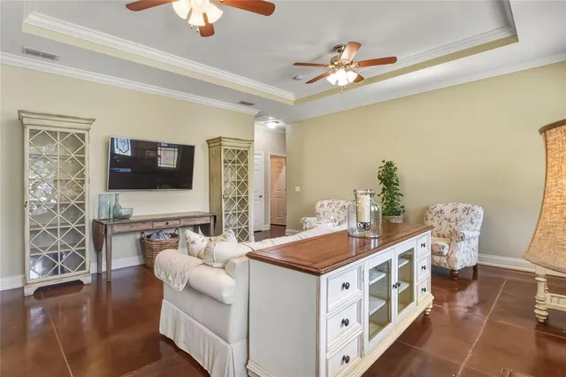 a view of a dining room with furniture a chandelier and wooden floor