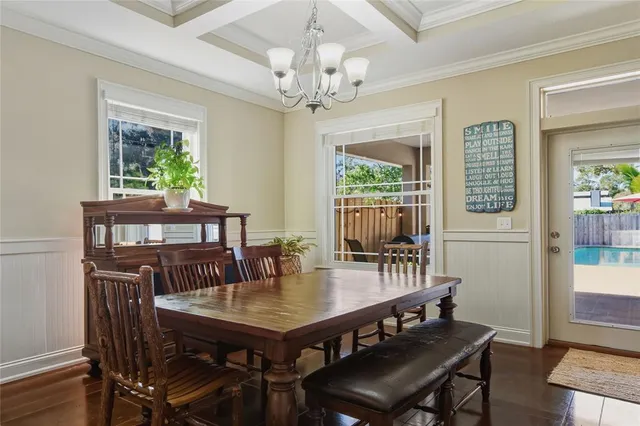 a kitchen with stainless steel appliances granite countertop a sink stove refrigerator granite counter tops and a window