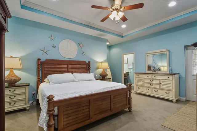 a en suite bathroom with a granite countertop sink and a mirror