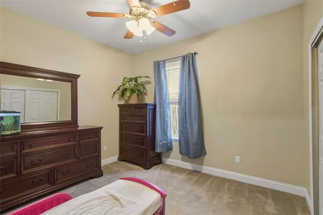 a view of a backyard with a patio and fire pit