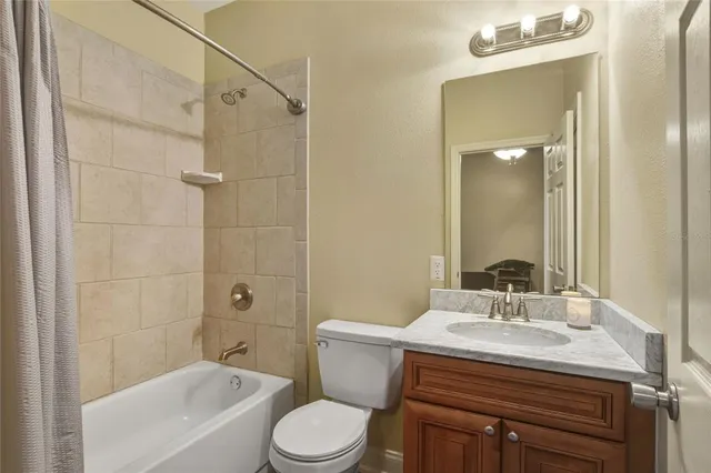 a view of a backyard with table and chairs under an umbrella