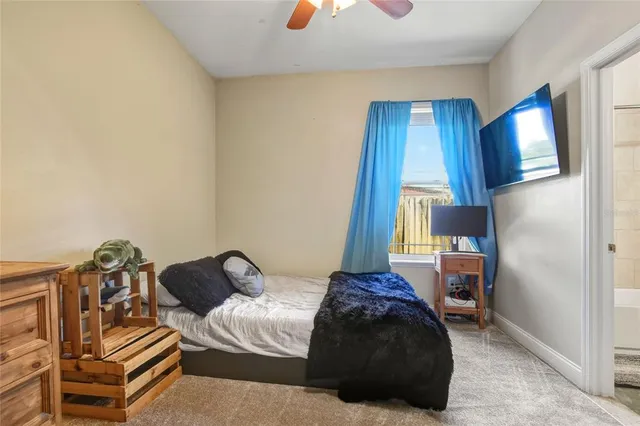 a view of a backyard with a wooden fence