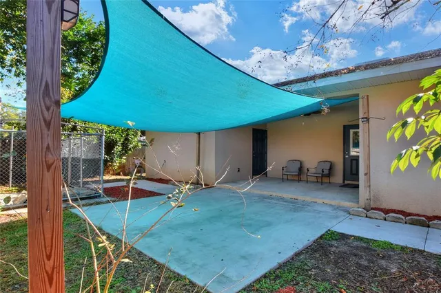a view of a backyard with a patio