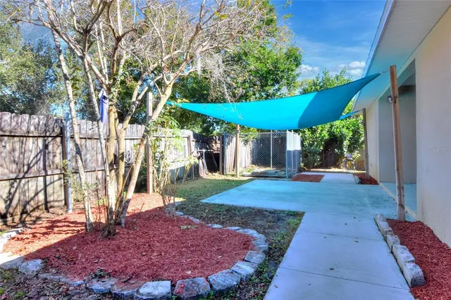 a view of a swimming pool with a patio