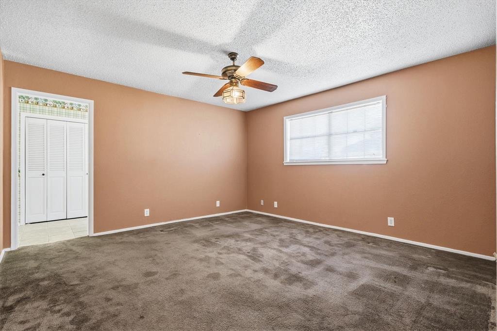 216 Helen Drive Lindale, TX 75771 - Photo 18 of 39 an empty room with windows and fan