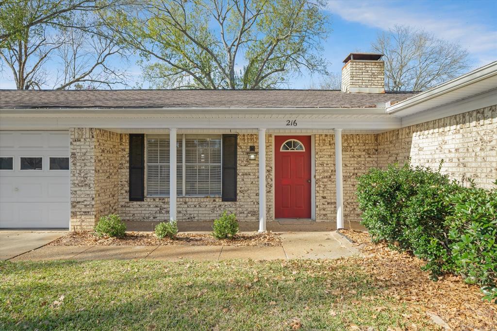 216 Helen Drive Lindale, TX 75771 - Photo 3 of 39 a front view of a house with a yard