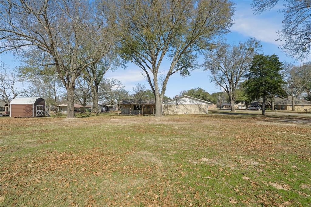 216 Helen Drive Lindale, TX 75771 - Photo 37 of 39 a view of road with large trees