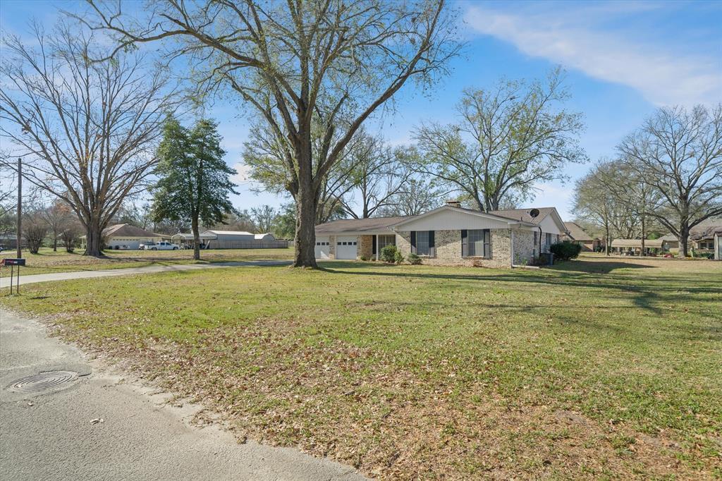 216 Helen Drive Lindale, TX 75771 - Photo 38 of 39 a front view of a house with a yard