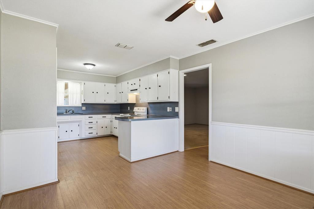 216 Helen Drive Lindale, TX 75771 - Photo 6 of 39 a view of kitchen with stainless steel appliances cabinets and wooden floor